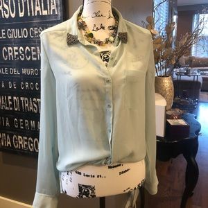 Trouvè blouse with embellishments on collar